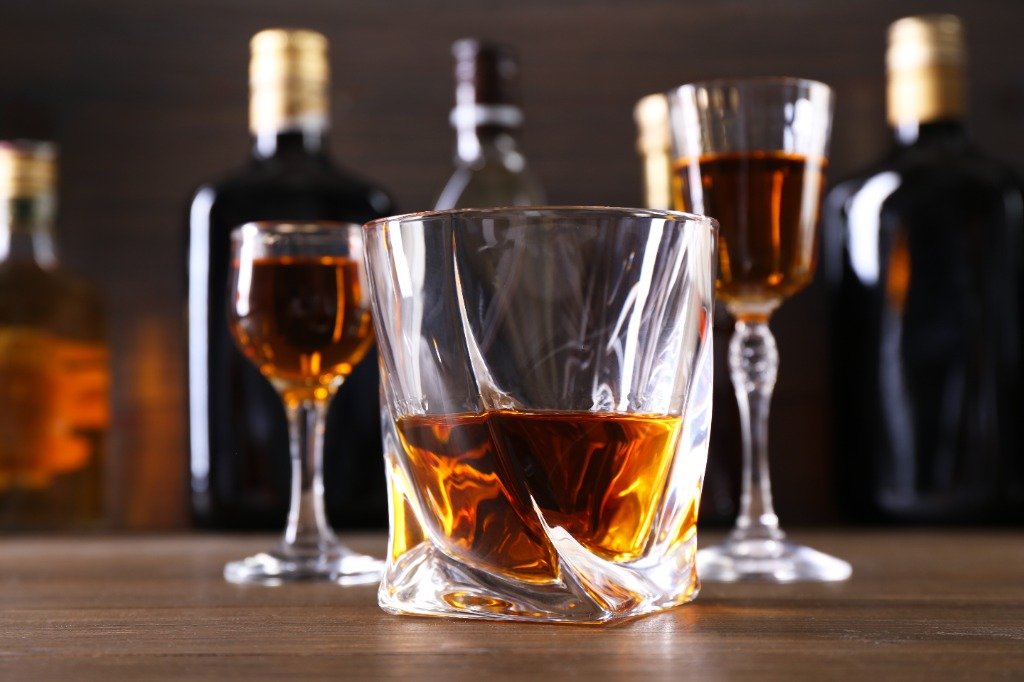 Aged Whiskey glasses and bottles